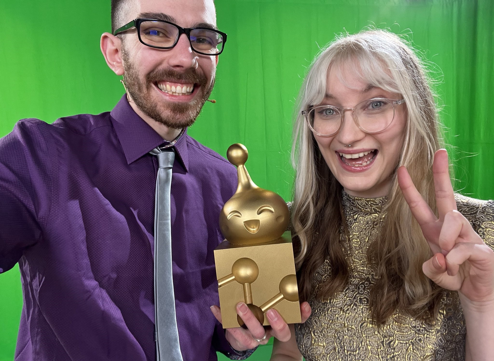 Tom Dent and Jen Simpkins with an Impy Award.